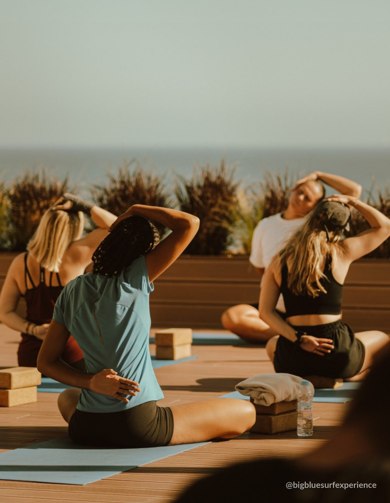 Rooftop yoga session facing the Atlantic at BigBlue Taghazout